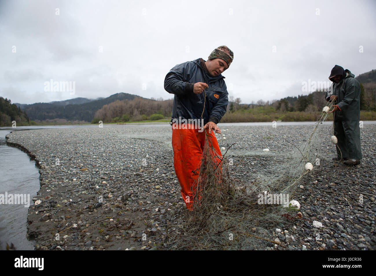 Members of the Yurok Indian Tribe clean their gill net while