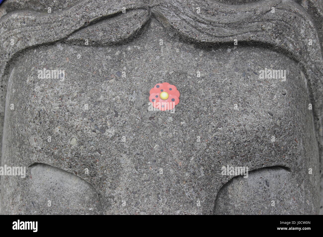 Memorial day. Closeup of a red poppy sticker on the concrete street barricade lion's head, in remembrance of all the Stockholm's terrorist truck attacker victims. Drottninggatan (Queen Street) & Kungsgatan, Stockolm city, Sweden. Credit: BasilT/Alamy Live News Stock Photo