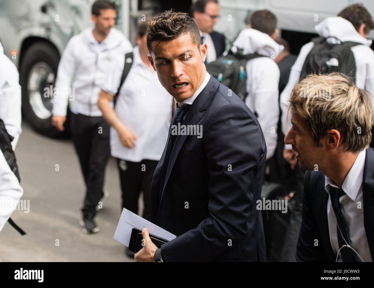 Munich, Germany. 11th Apr, 2017. Real Madrid's Cristiano Ronaldo (L) and Fabio Coentrao (R) arrive at the team hotel in Munich, Germany, 11 April 2017. The Champions League quarterfinals first leg match between FC Bayern Munich and Real Madrid begins 12 April 2017. Credit: dpa picture alliance/Alamy Live News Stock Photo