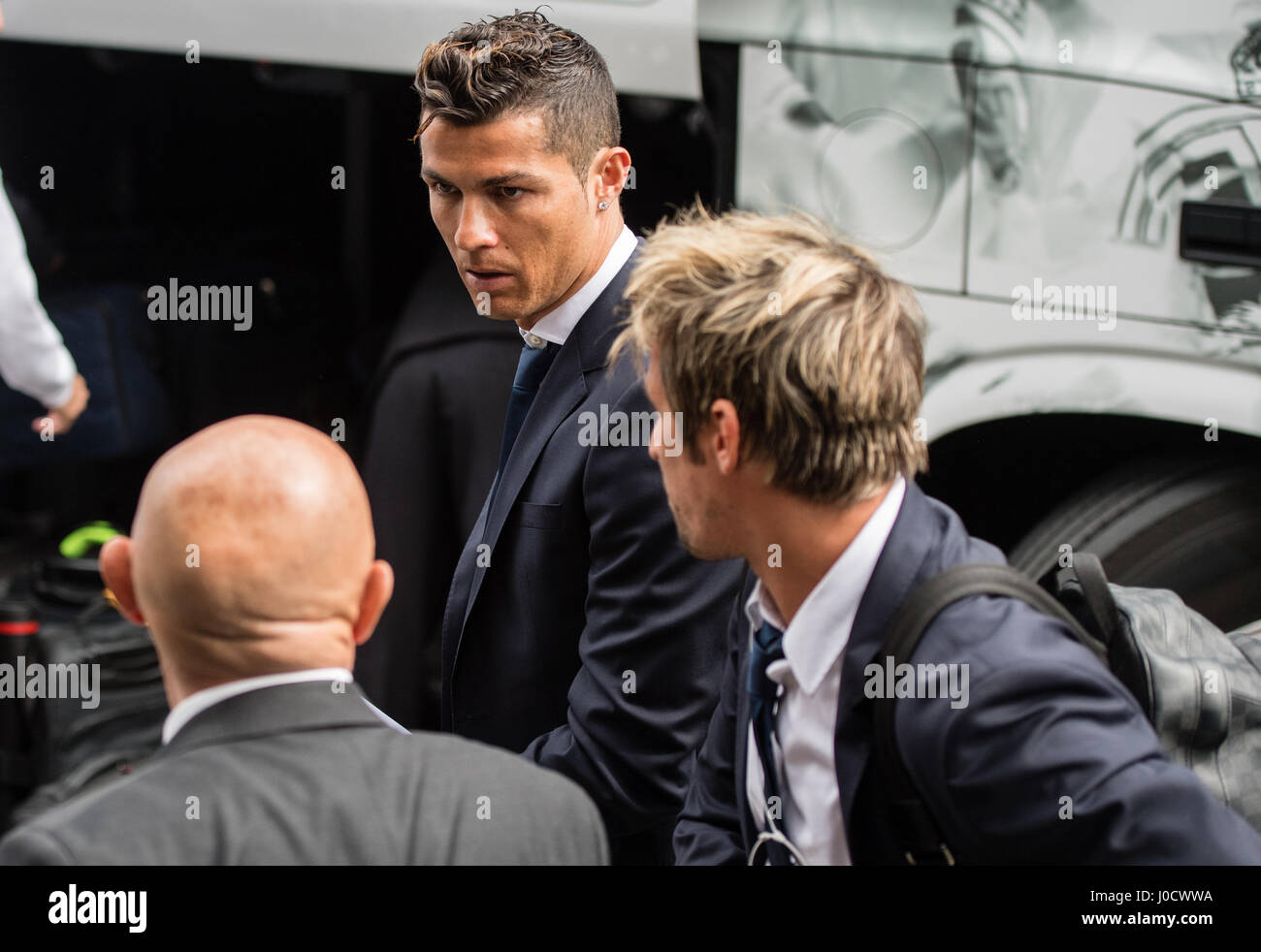 Munich, Germany. 11th Apr, 2017. Real Madrid's Cristiano Ronaldo (C) and Fabio Coentrao (R) arrive at the team hotel in Munich, Germany, 11 April 2017. The Champions League quarterfinals first leg match between FC Bayern Munich and Real Madrid begins 12 April 2017. Credit: dpa picture alliance/Alamy Live News Stock Photo