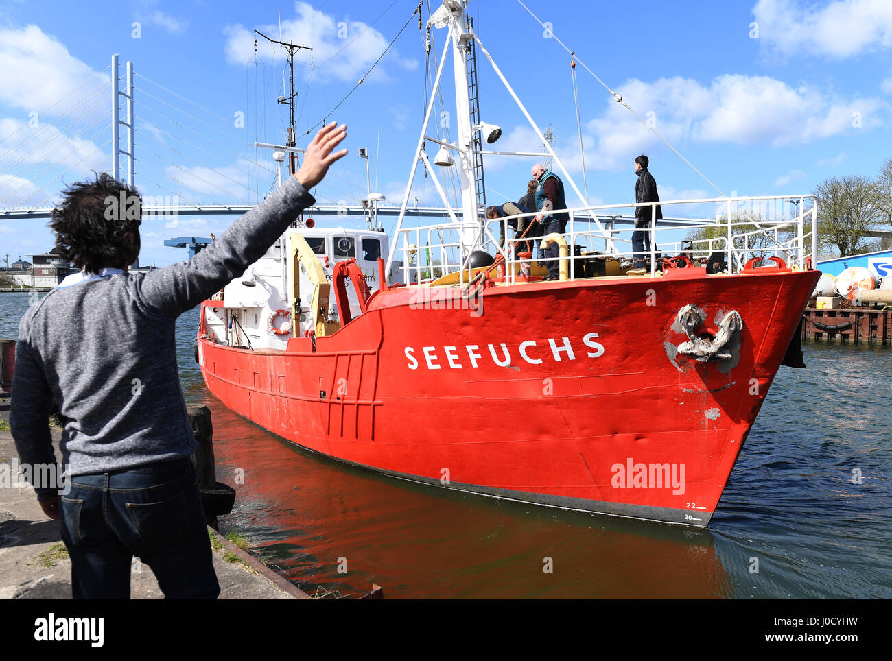 Stralsund, Germany. 11th Apr, 2017. The Seefuchs, a cutter belonging to a refugee initiative called Sea Eye, behind initiative founder Michael Buschheuer, in Stralsund, Germany, 11 April 2017. The vessel is equipped with 1500 life vests and life rafts for 500 people. It will assist shipwrecked refugees near the Libyan coast. Photo: Stefan Sauer/dpa-Zentralbild/dpa/Alamy Live News Stock Photo