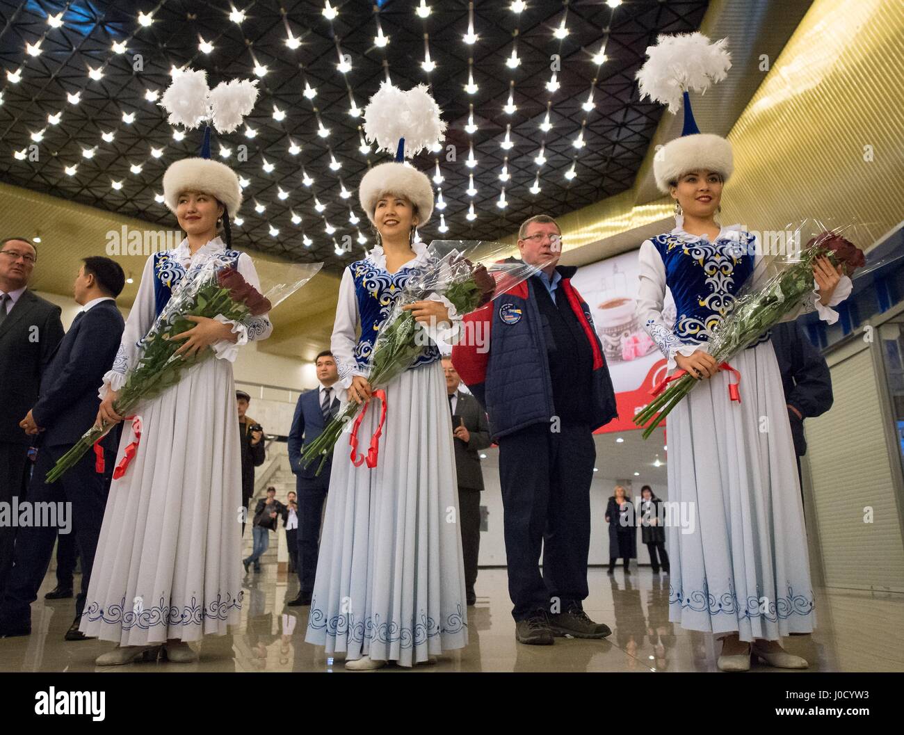 Zhezkazgan, Kazakhstan. 10th Apr, 2017. Kazakh women in traditional Kazakhstan costume wait for the crew of Expedition 50 at Karaganda Airport during the welcome ceremony after they landed in a remote area April 10, 2017 near Zhezkazgan, Kazakhstan. The spacecraft returned carrying the International Space Station Expedition 50 mission crew after 173 days in space. Credit: Planetpix/Alamy Live News Stock Photo