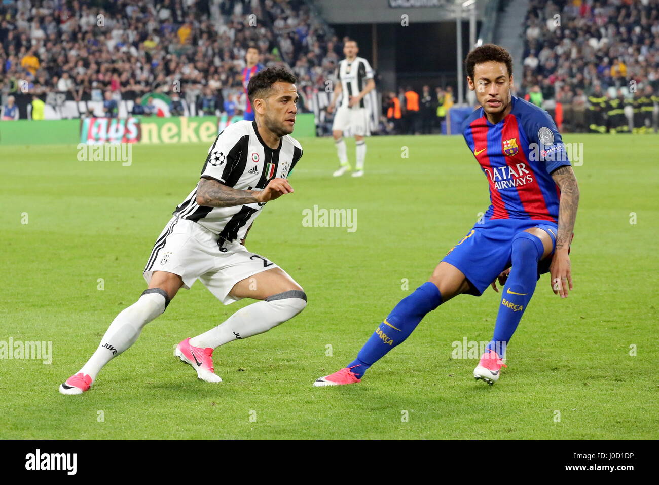 Turin, Italy. 11th Apr, 2017. Dani Alves (Juventus FC) and Neymar (FCB Barcelona) during the 1st leg of Champions League quarter-final between Juventus FC and FCB Barcelona at Juventus Stadium on April 11, 2017 in Turin, Italy. Juventus won 3-0 over Barcelona. Credit: Massimiliano Ferraro/Alamy Live News Stock Photo