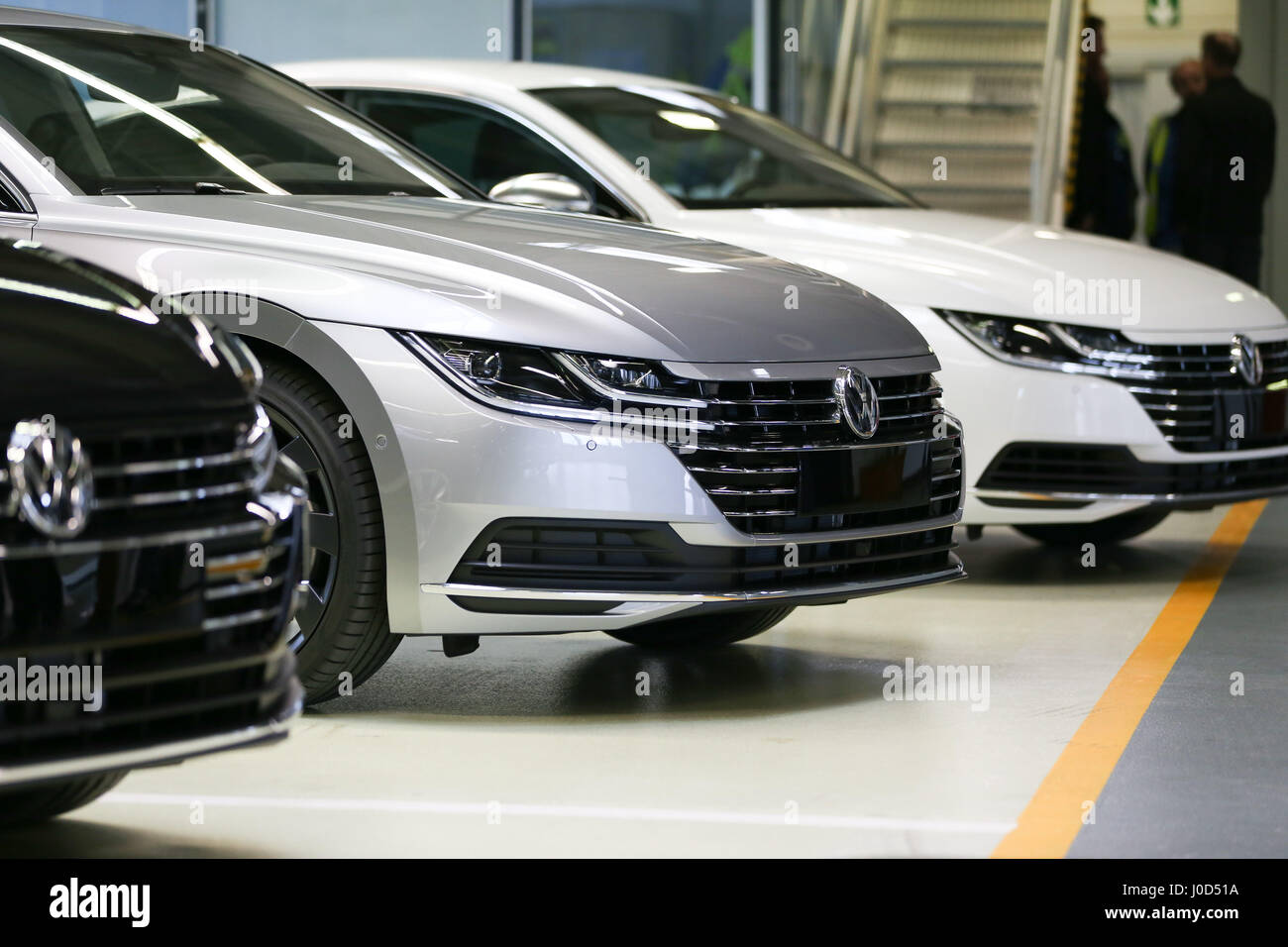 Emden, Germany. 12th Apr, 2017. VW Arteon cars can be seen during its presentation in Emden, Germany, 12 April 2017. The new Volkswagen model Arteon will be built in Emden. After low sale numbers of the VW Passat model, the VW factory in Emden hopes for a success with the new Arteon. Photo: Mohssen Assanimoghaddam/dpa/Alamy Live News Stock Photo