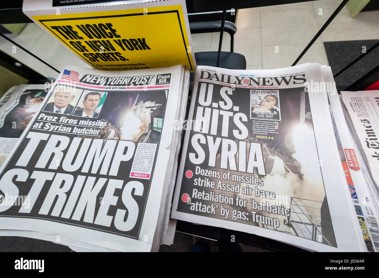 The New York Daily News, the New York Post and other papers report on Friday, April 7, 2017 on the previous evening's bombing of a Syrian air base in retaliation for the Assad government using chemical weapons. (© Richard B. Levine) Stock Photo