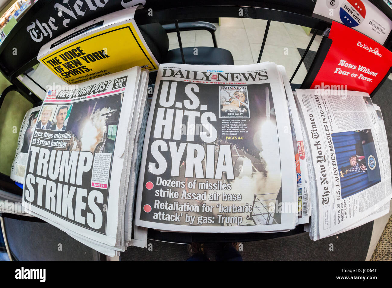 The New York Daily News, the New York Post and other papers report on Friday, April 7, 2017 on the previous evening's bombing of a Syrian air base in retaliation for the Assad government using chemical weapons. (© Richard B. Levine) Stock Photo