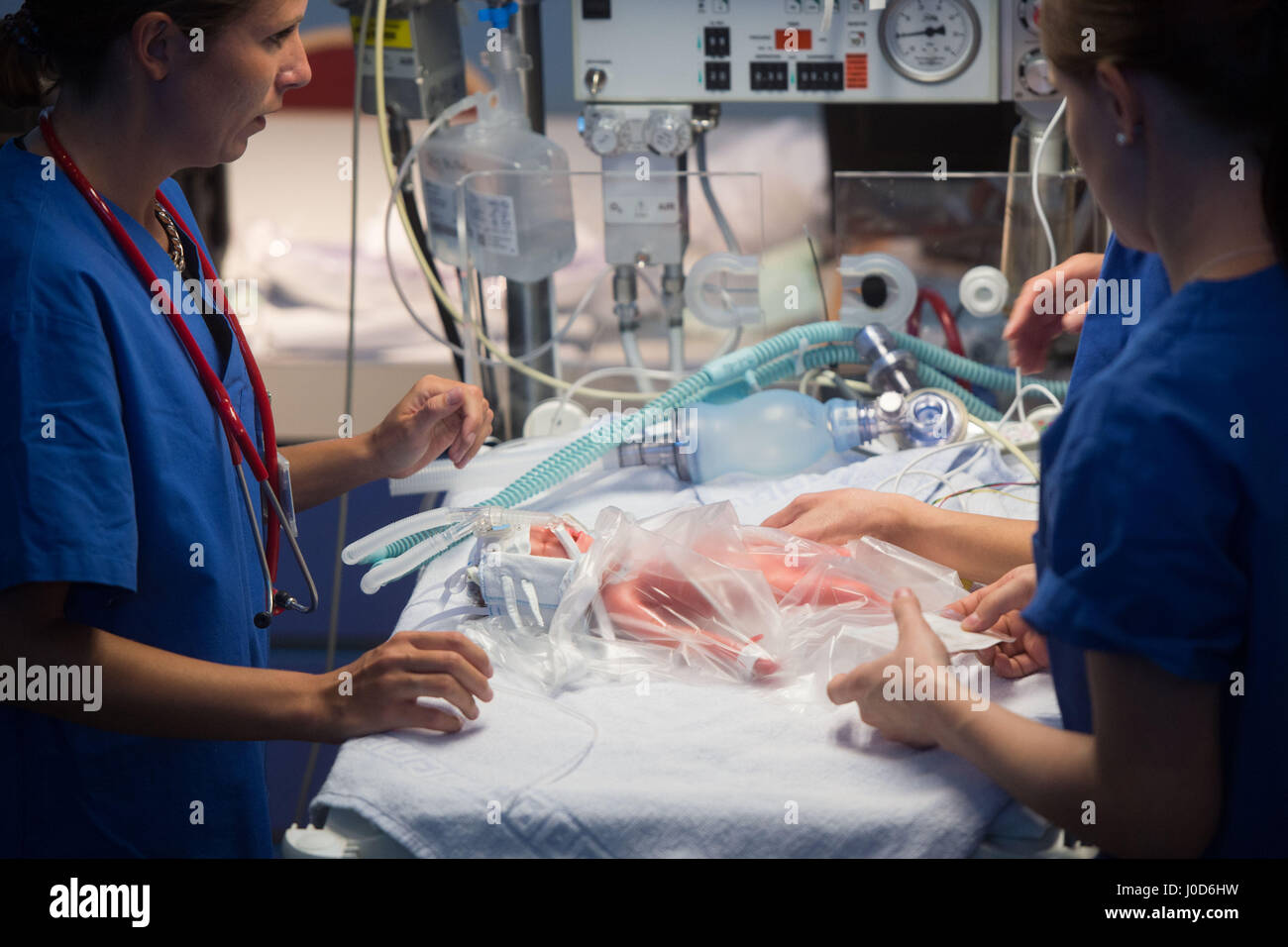 Tuebingen, Germany. 12th Apr, 2017. Doctors carry out a demonstration using a doll representing a prematurely born baby in the women's clinic in Tuebingen, Germany, 12 April 2017. 'Paul', a premature birth simulation system, can simulate a variety of scenarios and is used for training purposes in the hospital. Photo: Lino Mirgeler/dpa/Alamy Live News Stock Photo