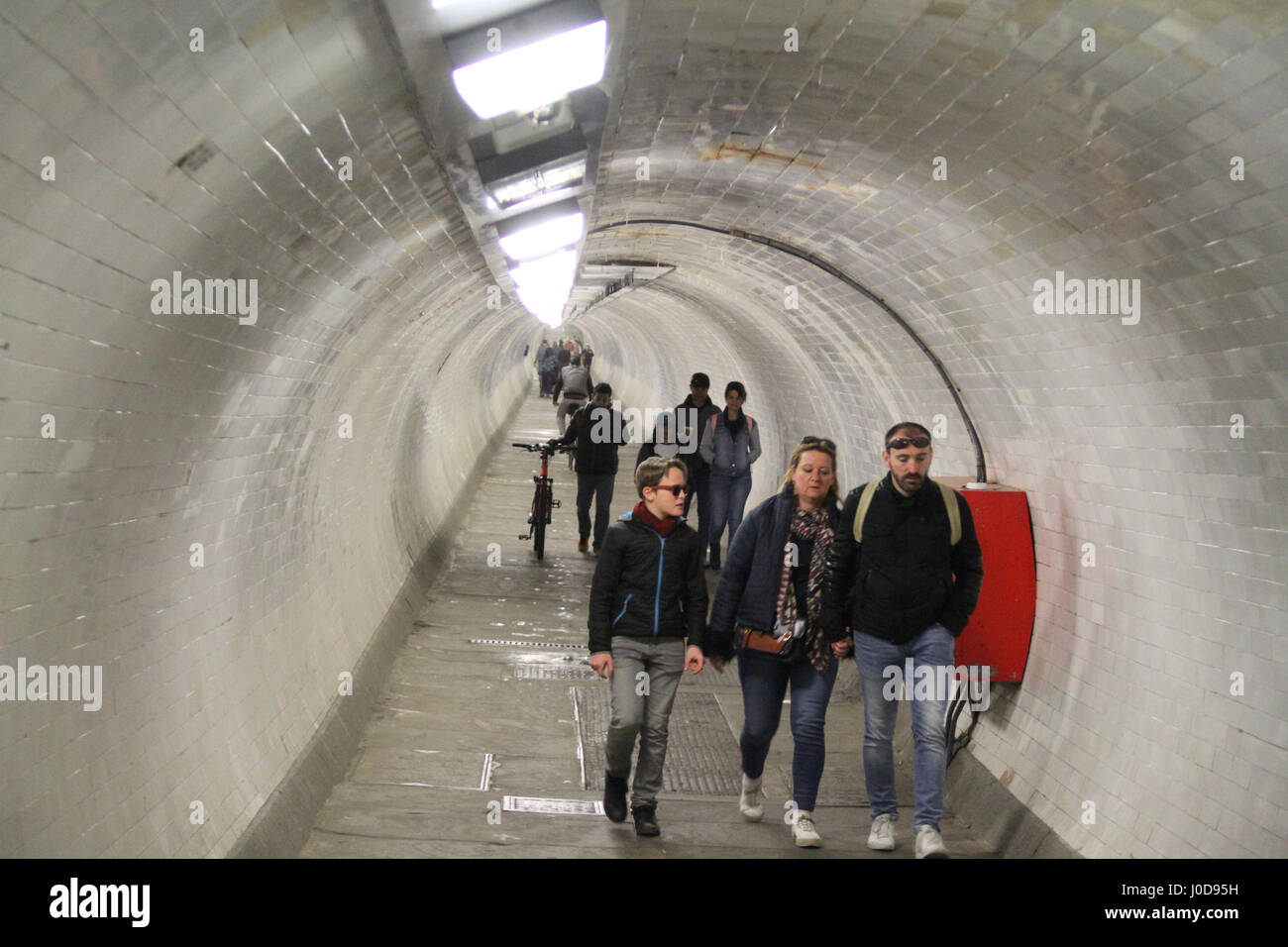 London, UK. 12th Apr, 2017. London, United Kingdom - April 12: People seen walking through the Greenwich foot tunnel on April 12 2017. The tunnel link Isle of Dogs on the north, with the Greenwich town centre. Credit: David Mbiyu/Alamy Live News Stock Photo