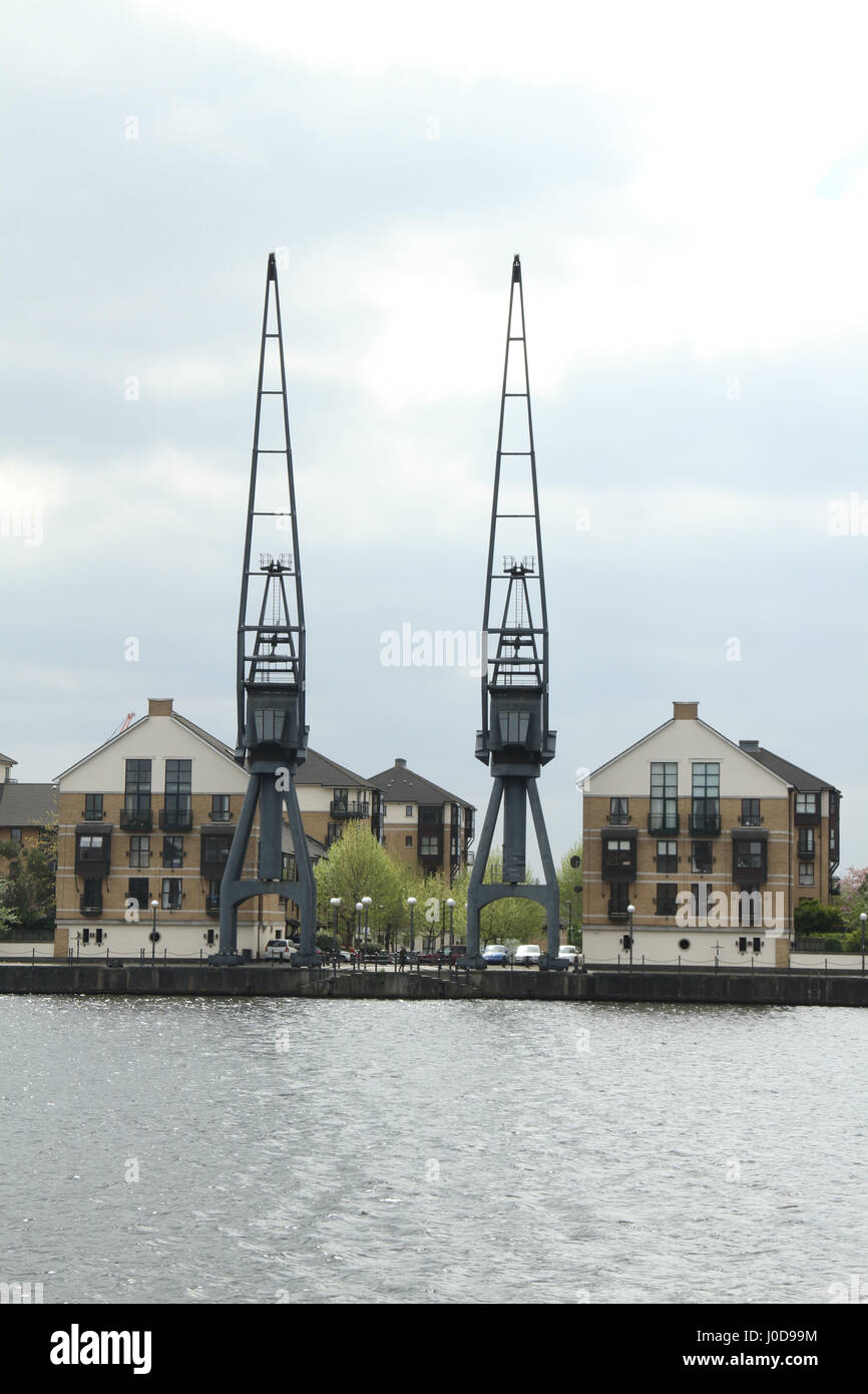 London, UK. 12th Apr, 2017. London, United Kingdom - April 12: Cranes and residential houses at the Royal Victoria in East London. The Royal Victoria Dock was the largest of three docks in the Royal Docks of east London, now part of the redeveloped Docklands. Credit: David Mbiyu/Alamy Live News Stock Photo