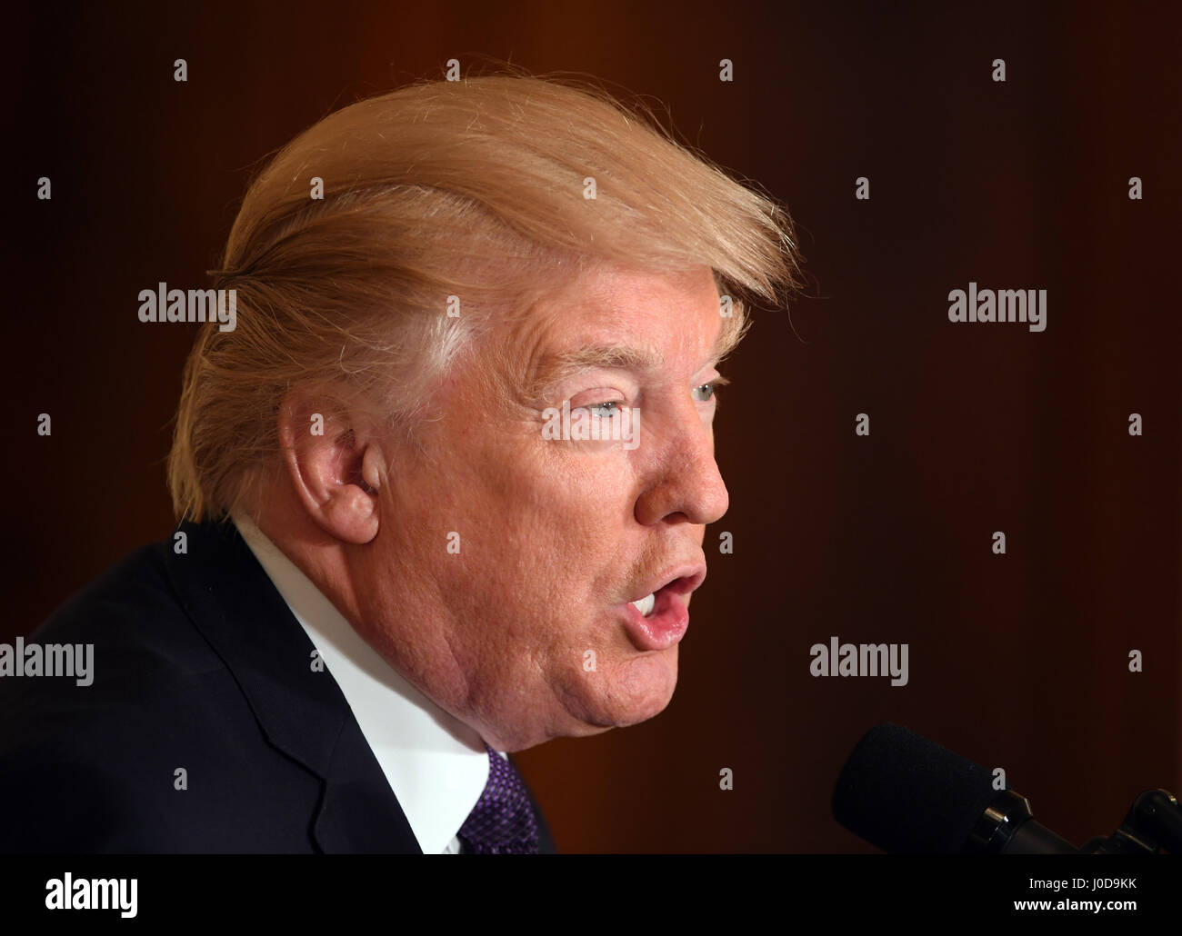 Washington, USA. 12th Apr, 2017. U.S. President Donald Trump addresses a press conference at the White House in Washington, DC, the United States, on April 12, 2017. U.S. President Donald Trump said on Wednesday that his administration won't label China as currency manipulator, and complained that the U.S. dollar is too strong. In an interview with Wall Street Journal on Wednesday, Trump said 'they (China) are not currency manipulators,' according to the report. Credit: Yin Bogu/Xinhua/Alamy Live News Stock Photo