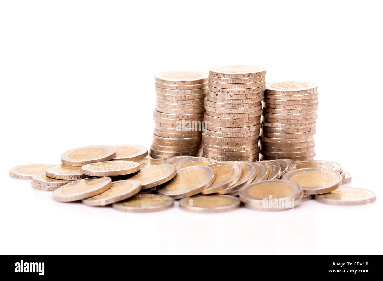 Heap of two euro coins isolated on white background Stock Photo - Alamy