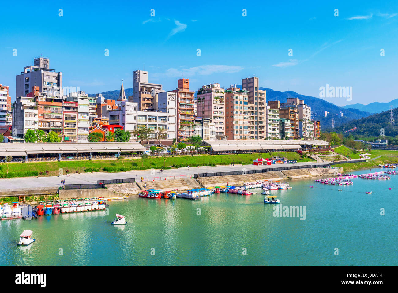 Riverside city buildings in the Xindian district of Taipei Stock Photo