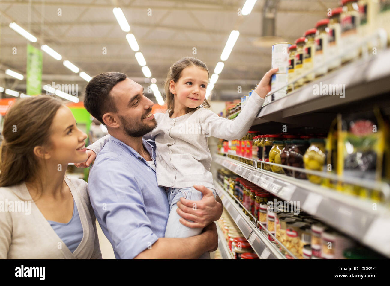 happy family buying food at grocery store Stock Photo Alamy