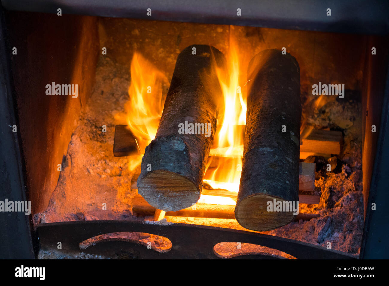 bright flame of fire burns in a fireplace, flame at Stove Stock Photo