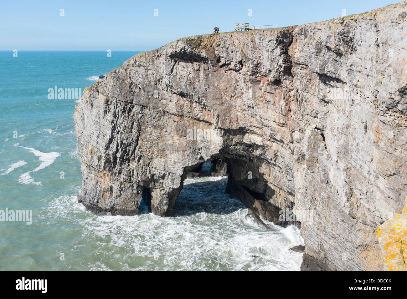 The Green Bridge of Wales is a natural arch formed from carboniferous limestone and is sited within the Pembrokeshire Coast National Park in Wales Stock Photo
