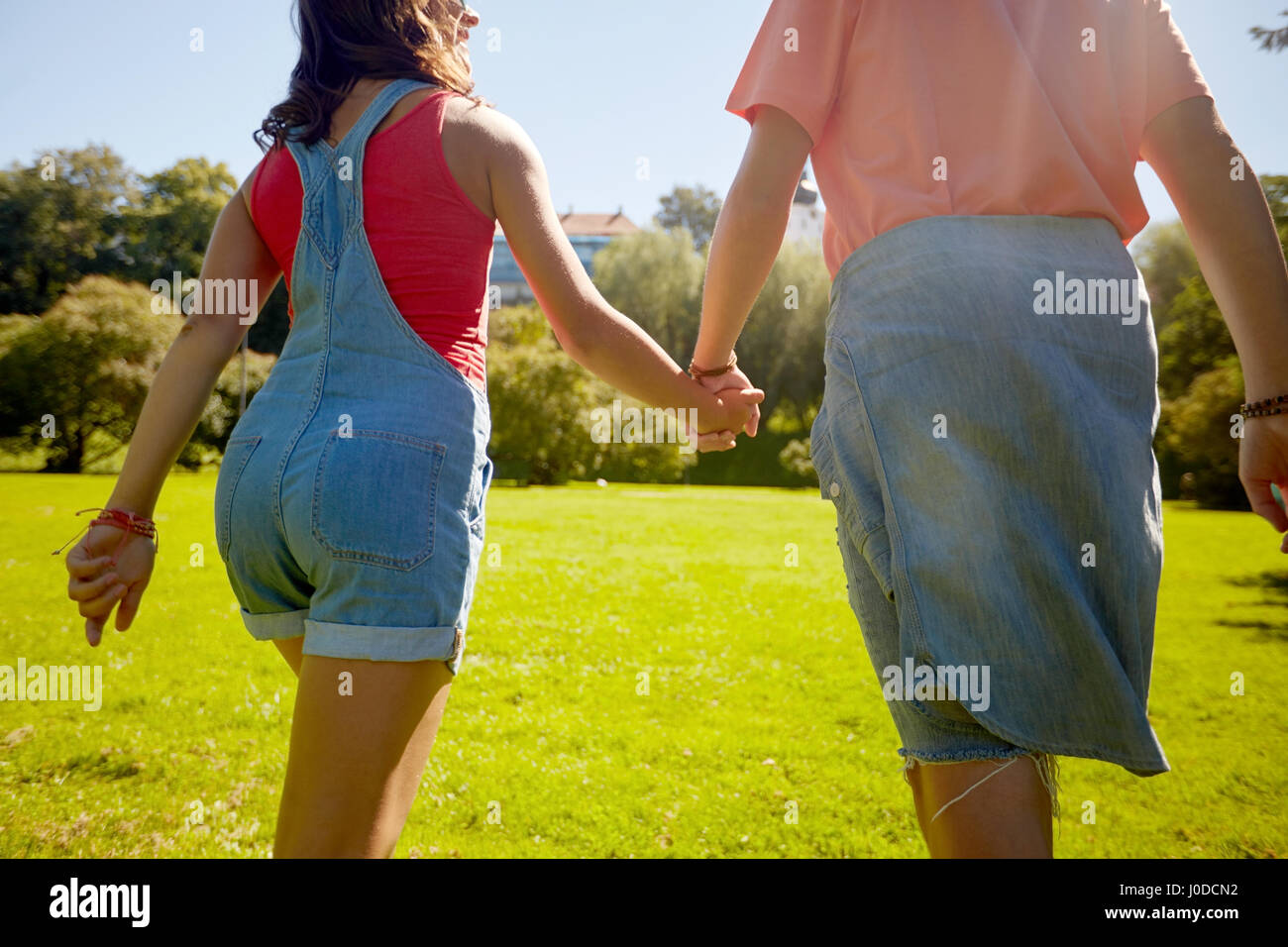 Back view teen girl walking hi-res stock photography and images - Alamy