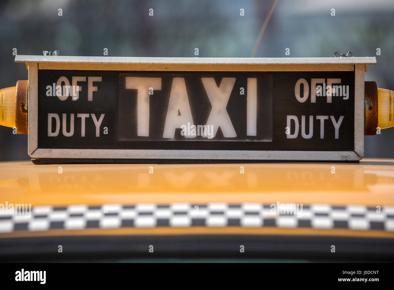 a closeup view of vintage taxi sign at big city Stock Photo