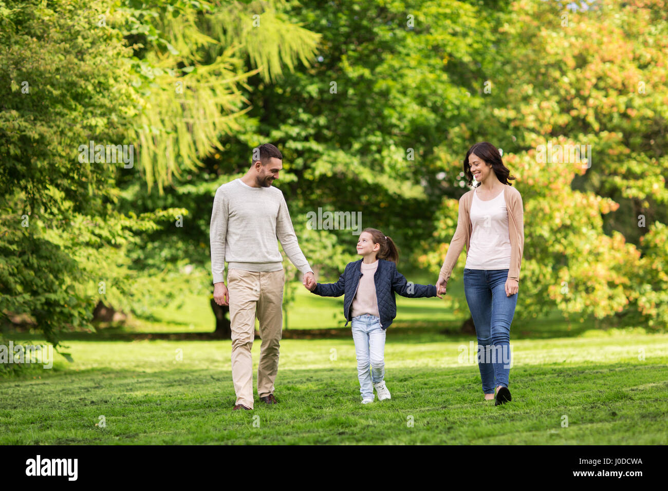 happy family walking in summer park Stock Photo - Alamy