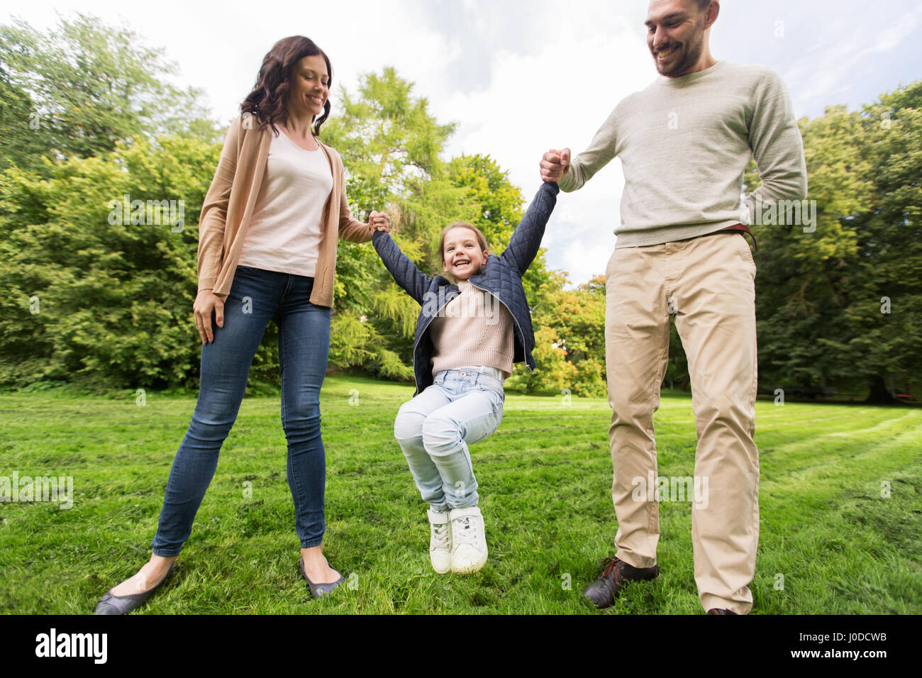happy family walking in summer park and having fun Stock Photo - Alamy