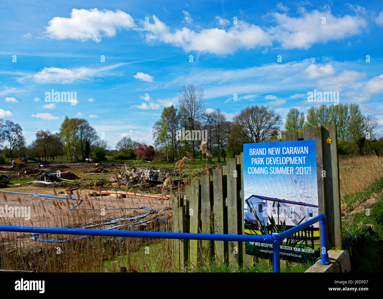 Sign announcing a new caravan park development near Oulton Broad, Suffolk, England UK Stock Photo
