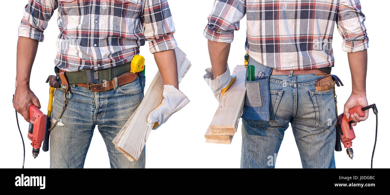 Builder handyman with drill and wooden plank. Stock Photo