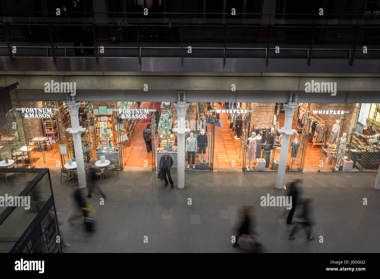 Fortnum & Mason shop next to a Whistles shop on an arcade inside St Pancras railway station