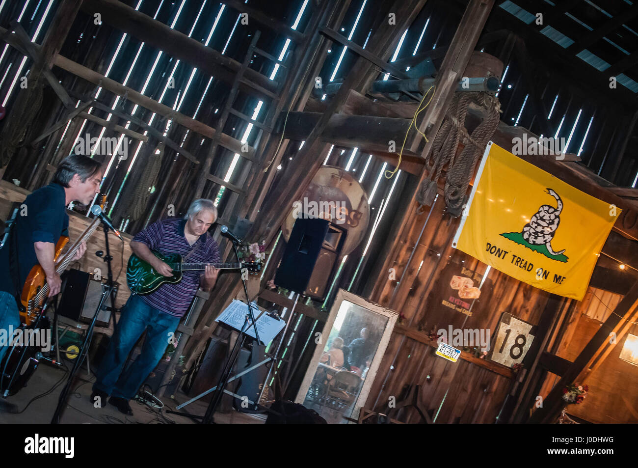 family party in old barn, Don't tread on me and American flags. Stock Photo