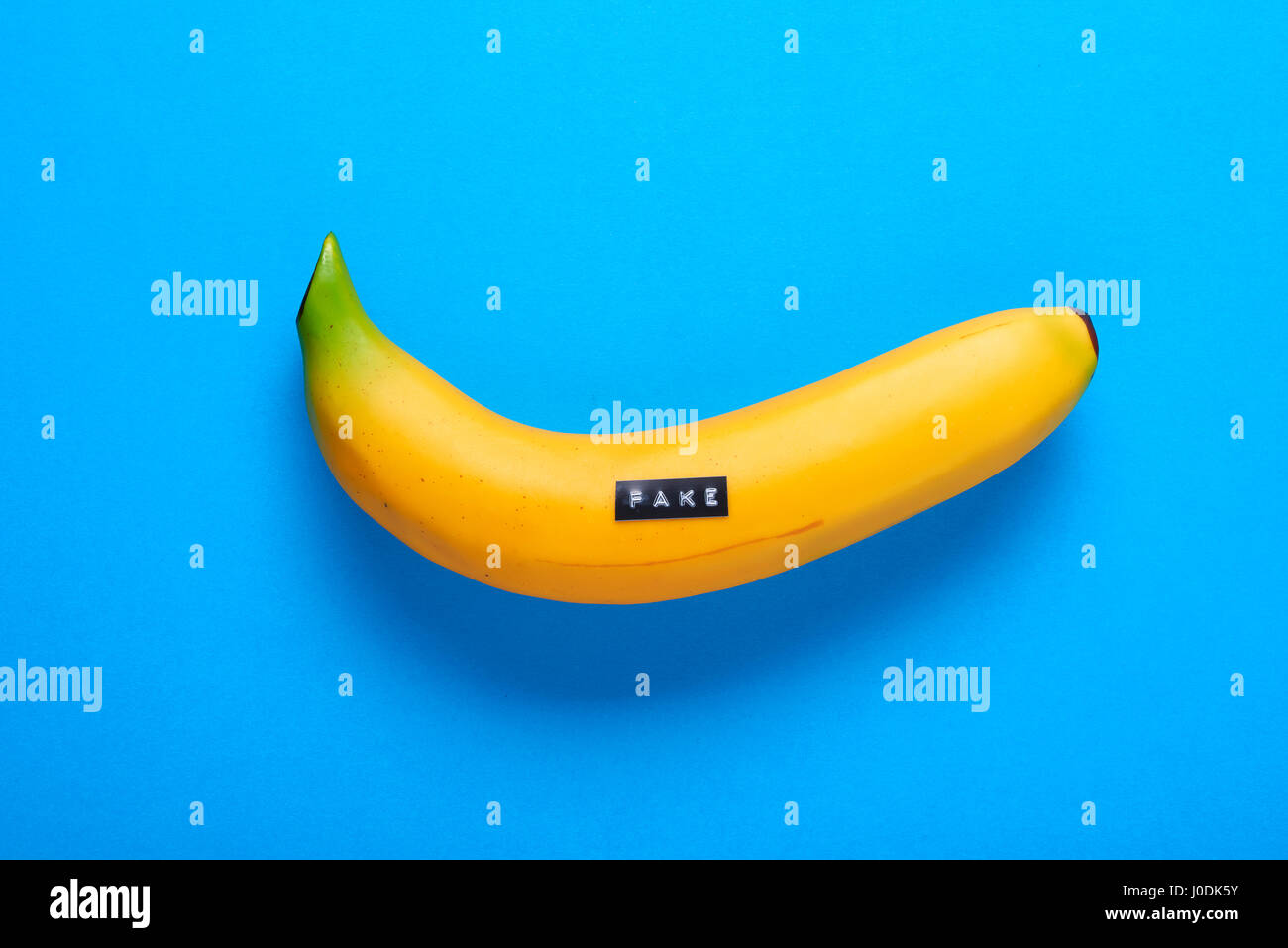 Fake plastic fruit - banana    - can be used for fake concept or fake news Stock Photo