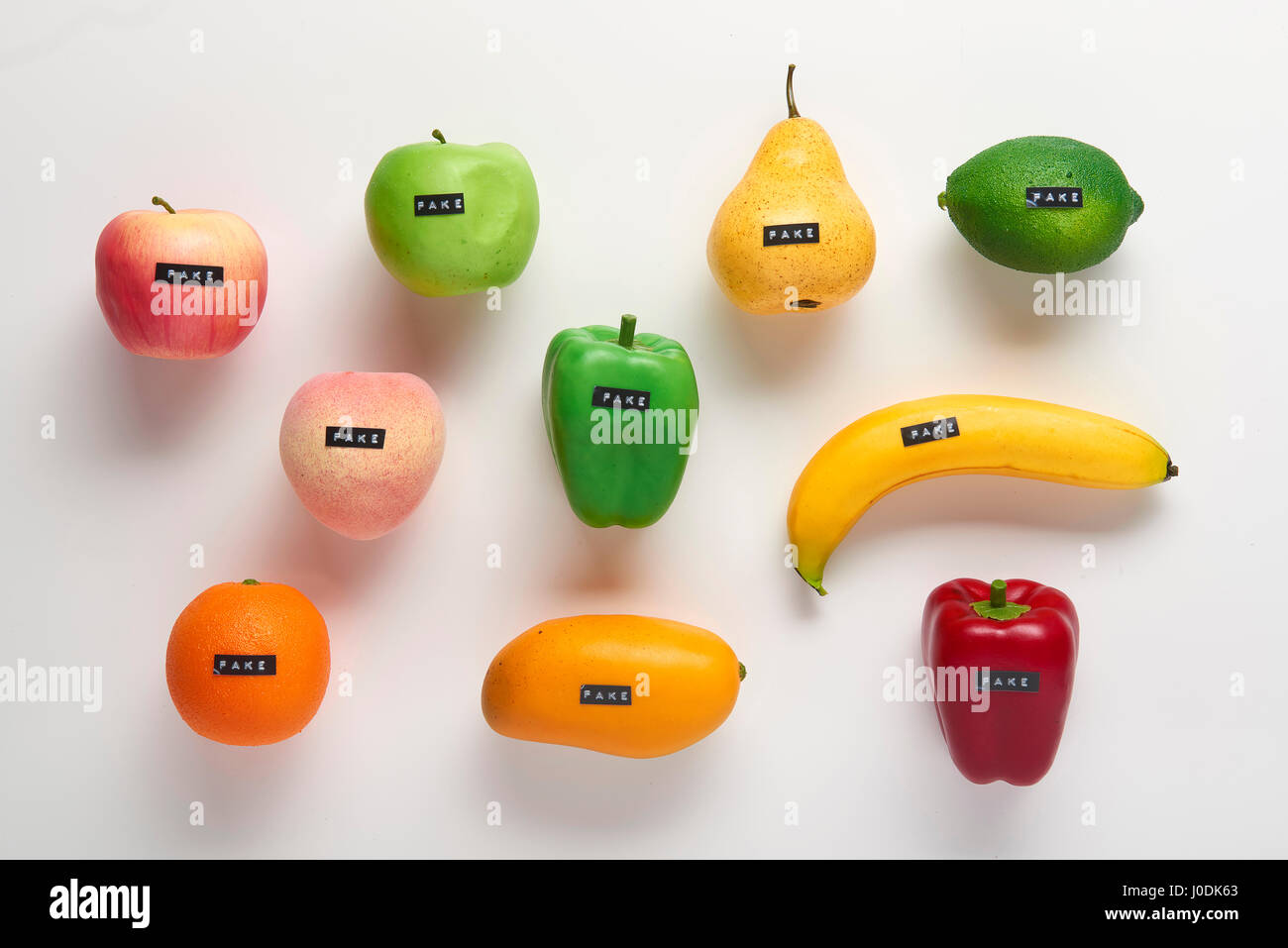 Fake plastic fruit and vegetables   - can be used for fake concept or fake news Stock Photo