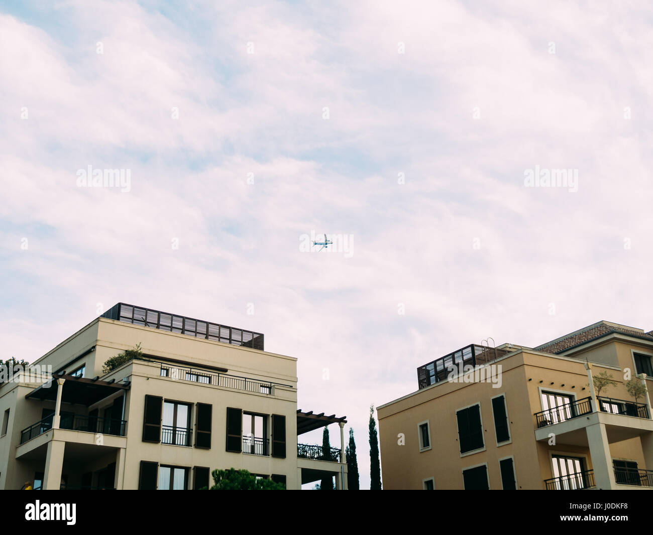 Plane in the sky Stock Photo - Alamy