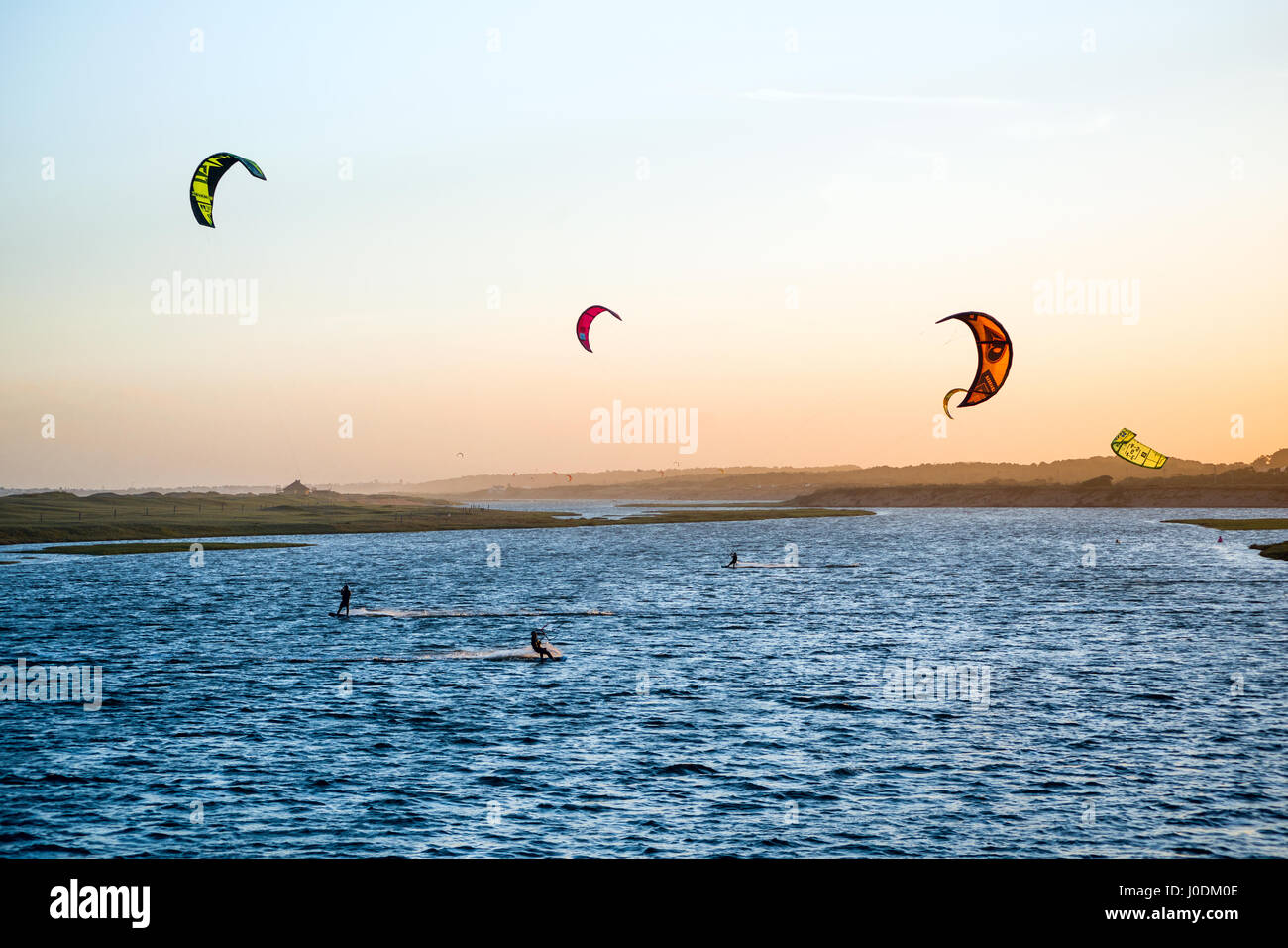 Jose Ignacio, Uruguay, April 1, 2017 -  Kiters on the Garzon Bay are using last summer days Stock Photo