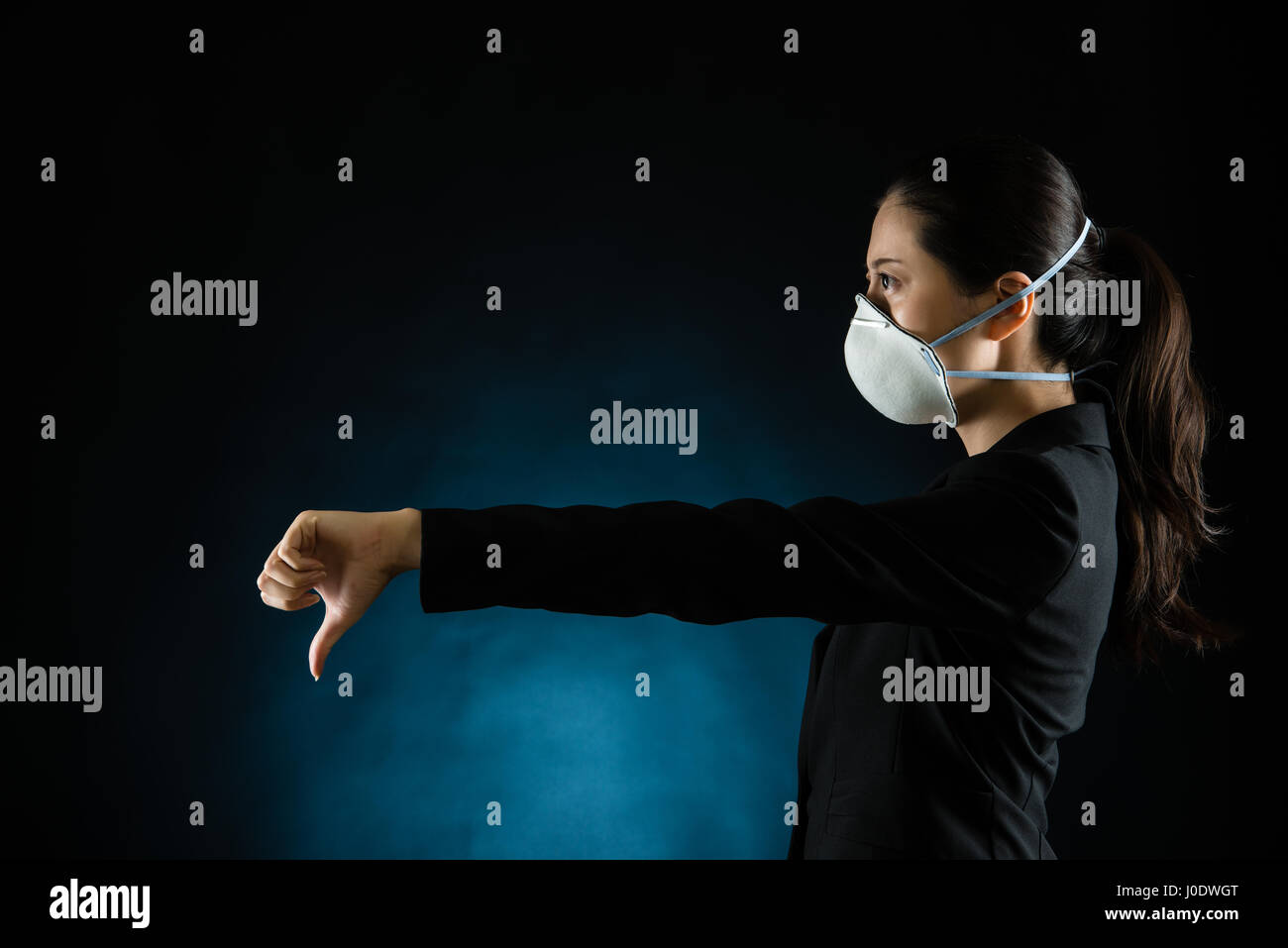 portrait of young business woman wearing a mask. presenting dislike gesture hand. Young multiracial Asian chinese female model Stock Photo