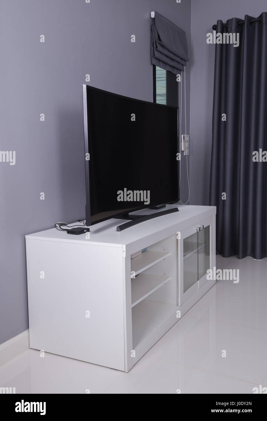 LED TV on white stand in living room Stock Photo Alamy