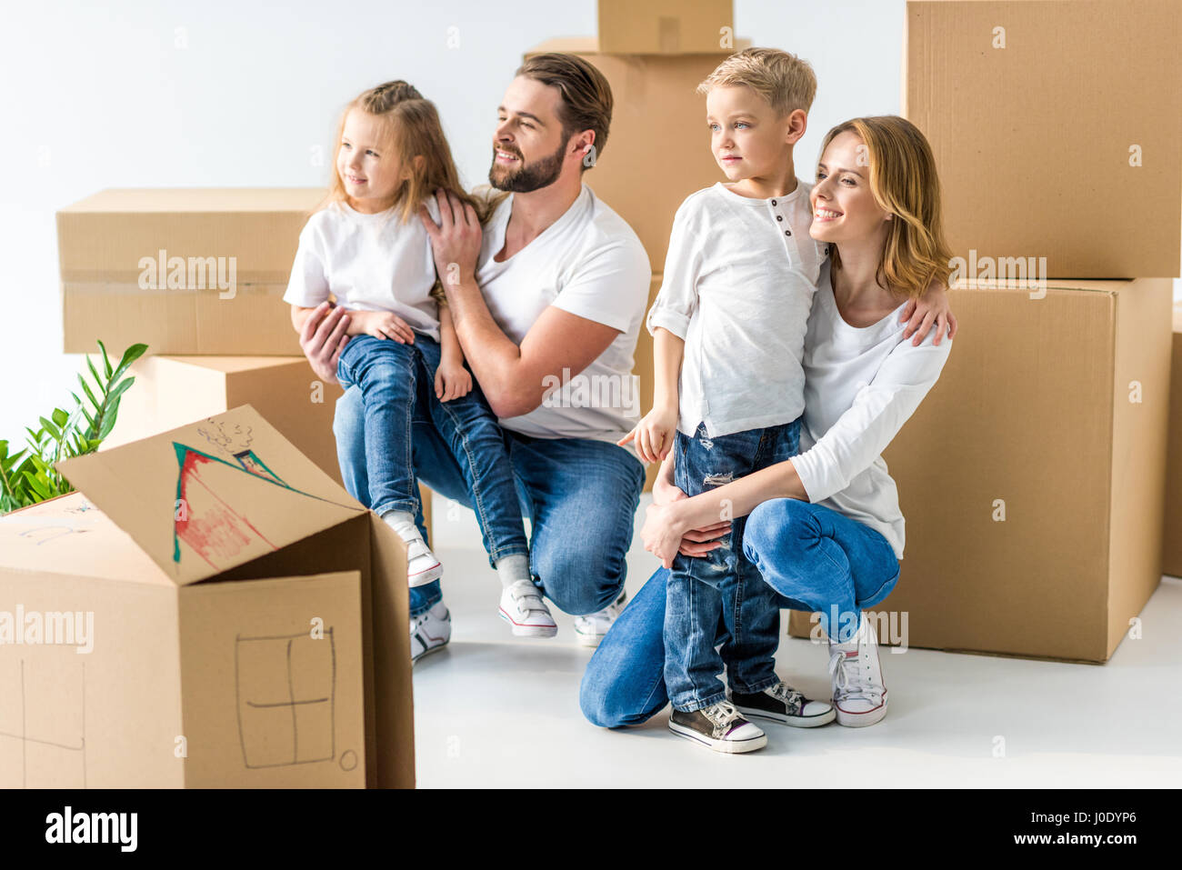 Young family of four hi-res stock photography and images - Alamy