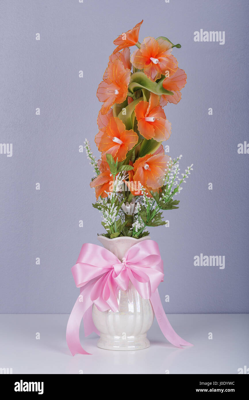 electric flower in vase on table with wall background Stock Photo Alamy