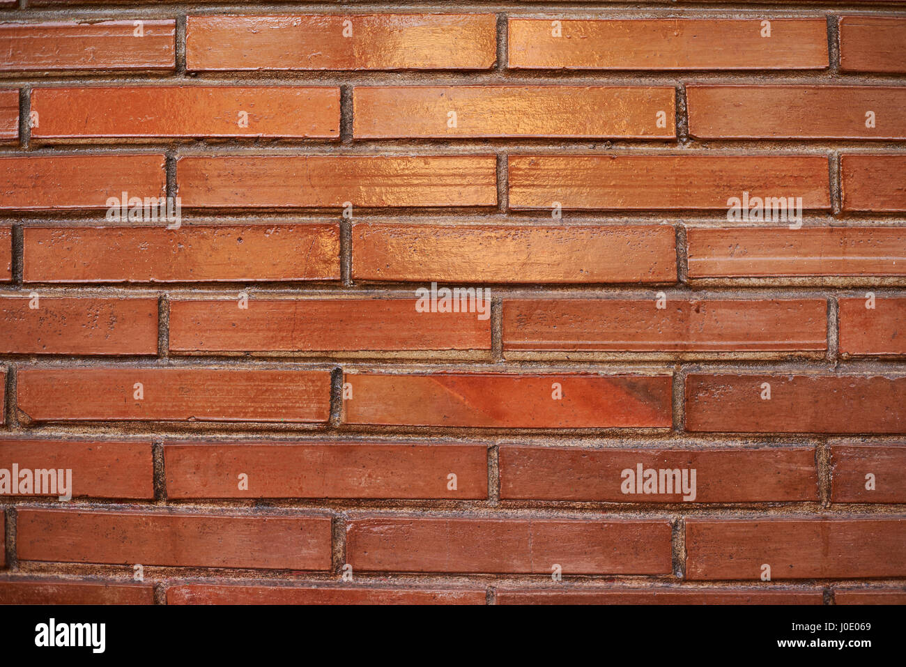 Red brick stone background close-up texture. Pattern on red brick wall Stock Photo