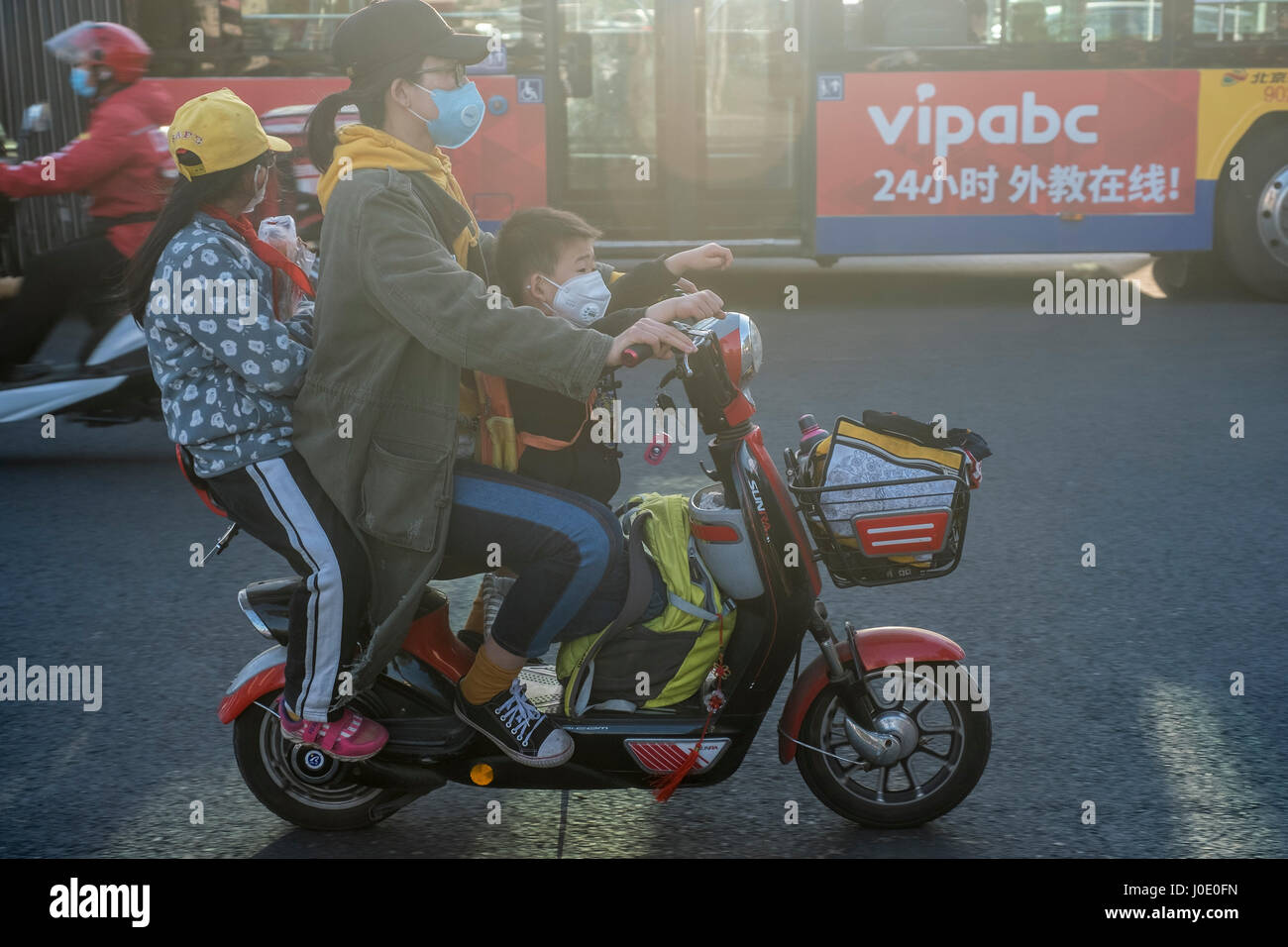 People wear masks due to poor air quality in Beijing, China. 11Apr
