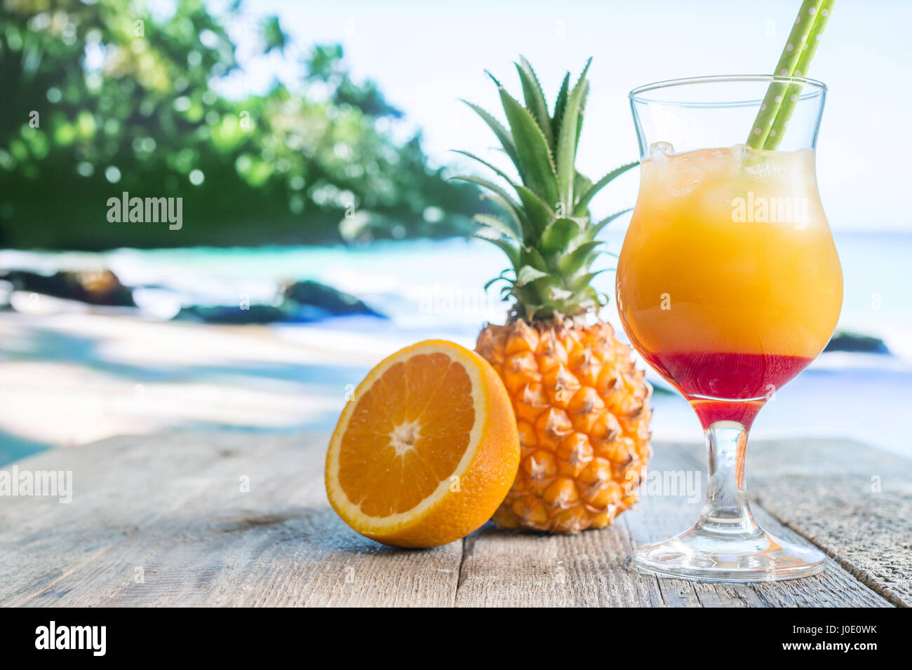 pineapple and orange cocktail with fresh fruits on the beach Stock ...