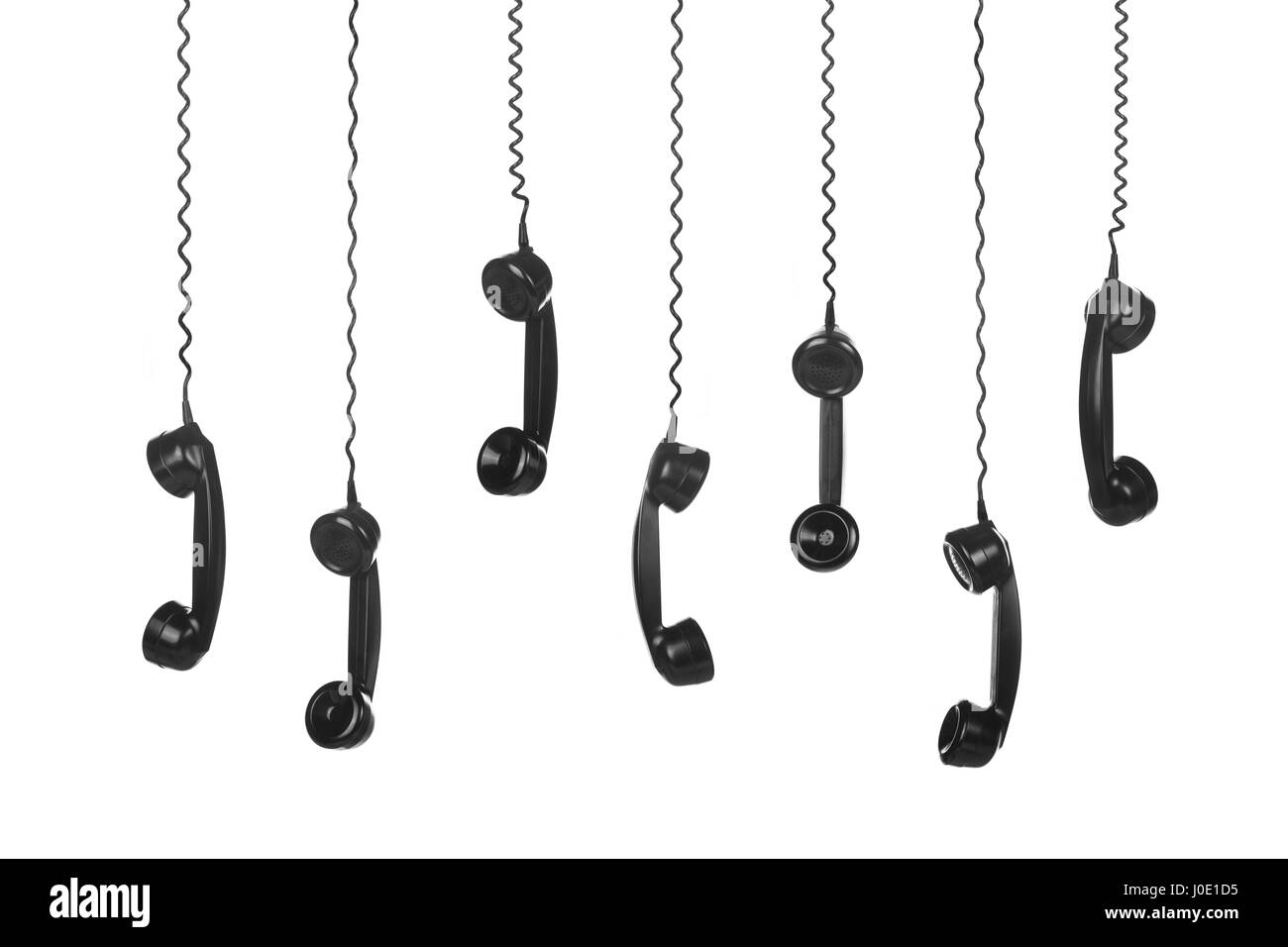 Old Vintage Black Telephone Handsets isolated on white background Stock