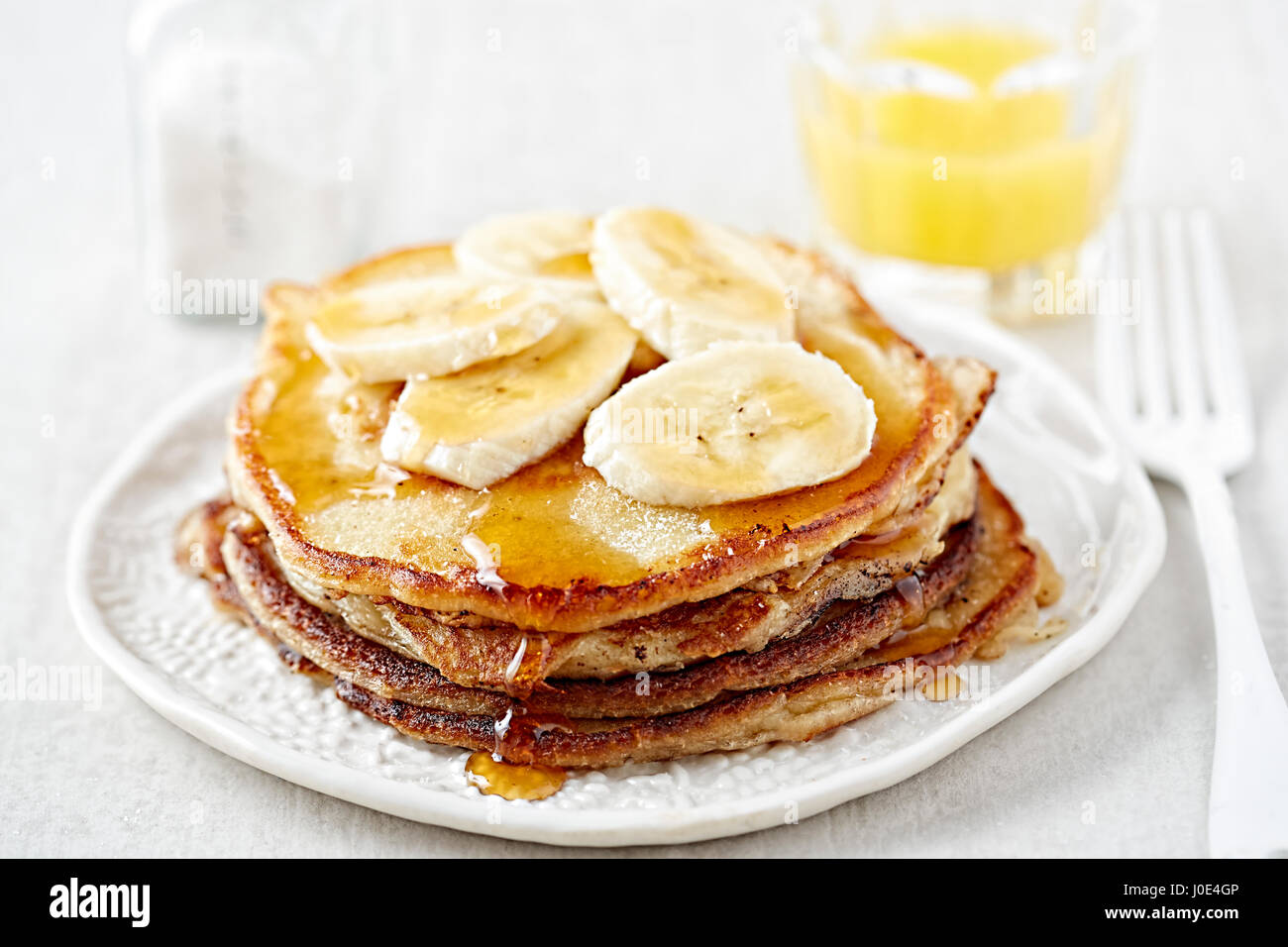 Banana pancakes maple syrup Stock Photo Alamy