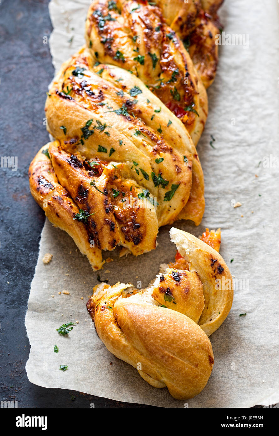 Twisted tomato paste bread with chargrilled peppers Stock Photo Alamy