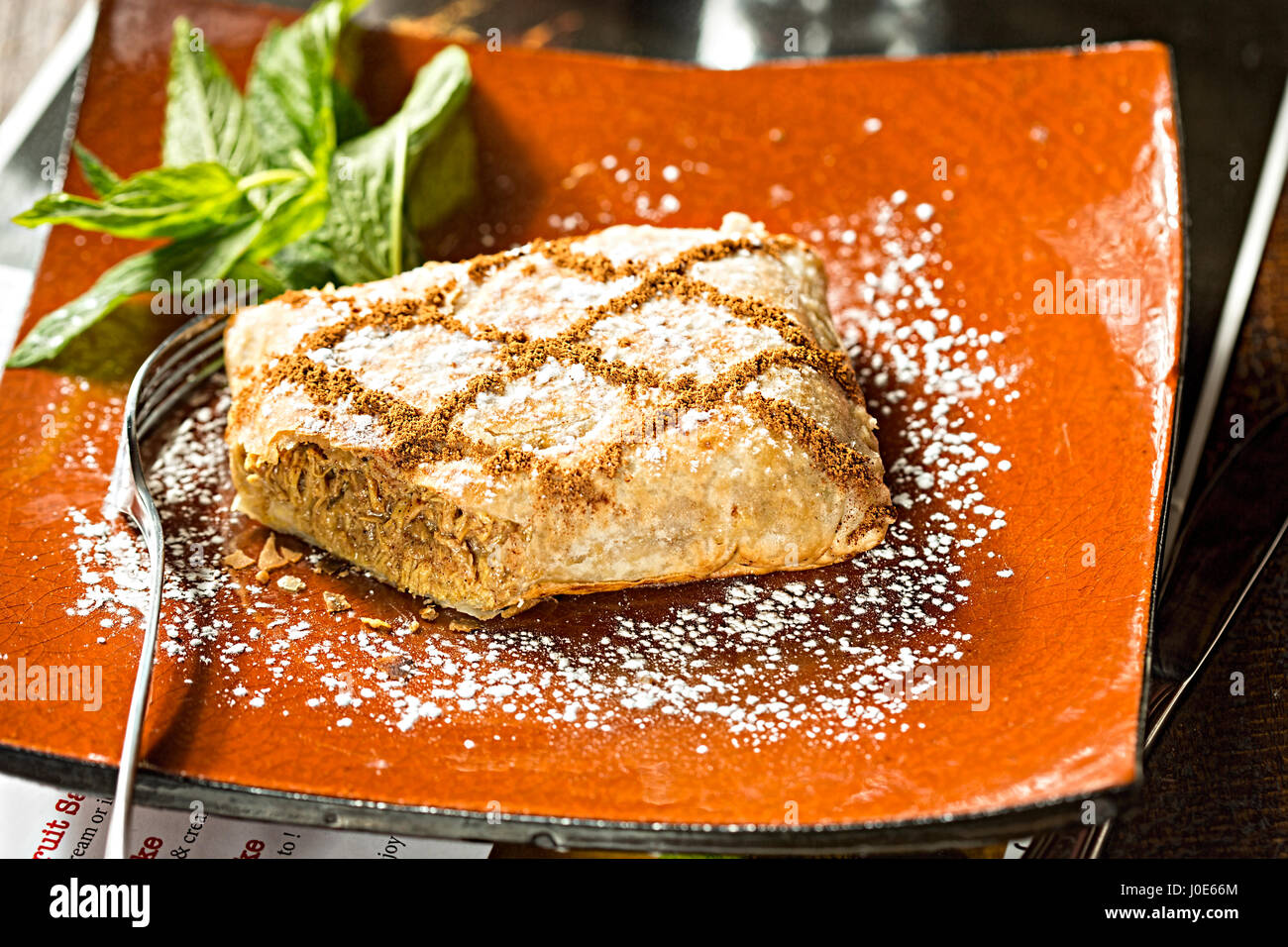 Chicken and cinnamon Moroccan savoury sweet filo pastry Stock Photo Alamy