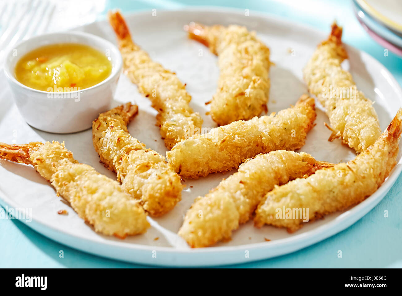 Prawns in coconut fried and served with mango chutney Stock Photo Alamy