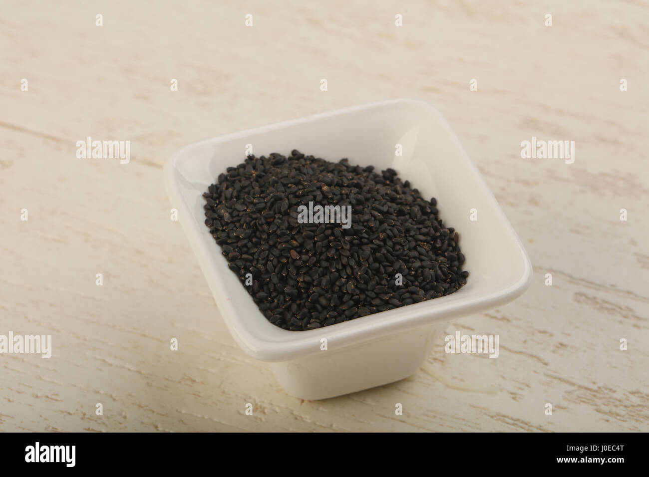 Black sesam seeds over wood background Stock Photo Alamy