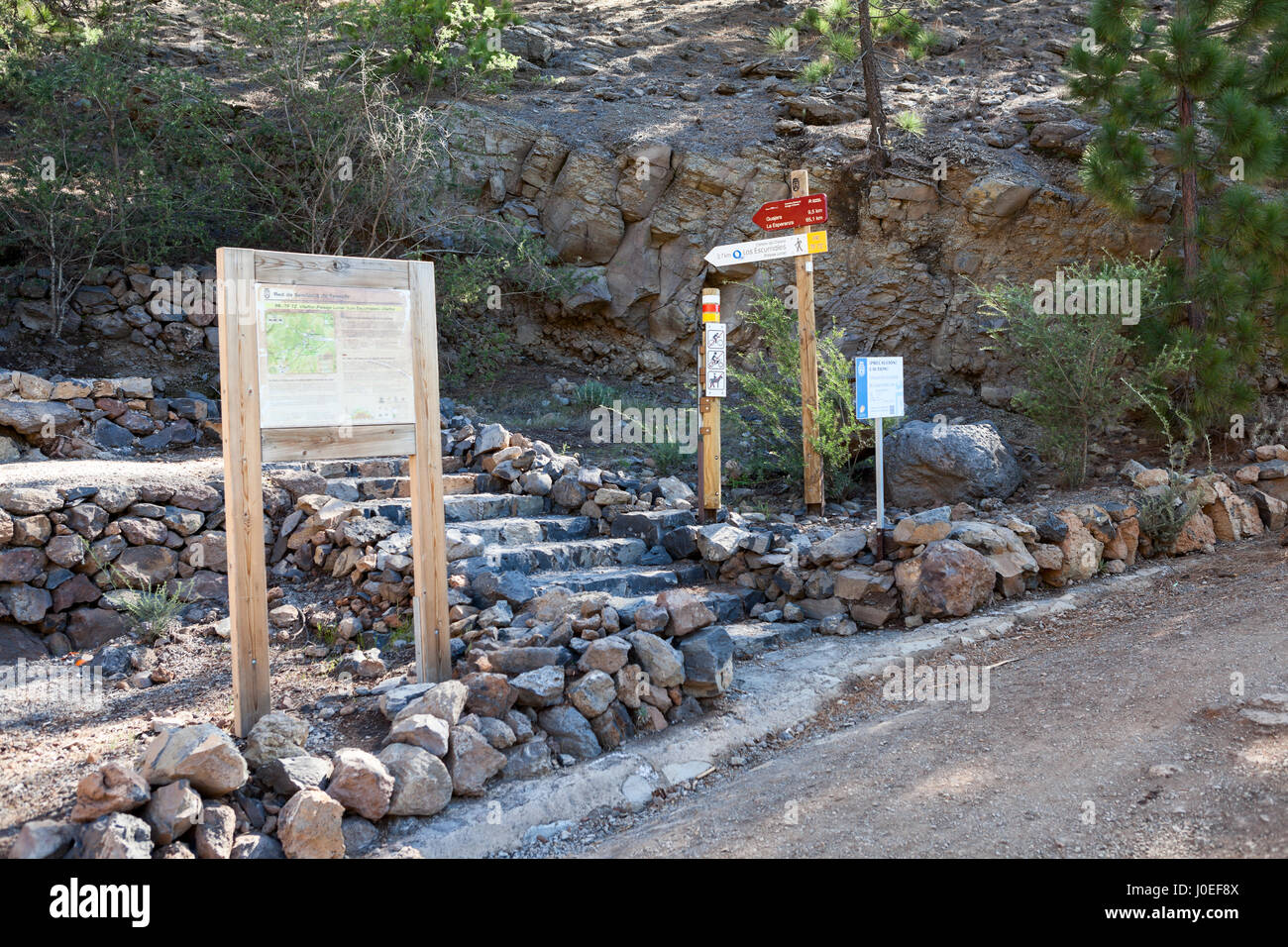 Information road signs and map are on the intermediate point of hiking trail with direction to La Esperanza and Lunar landscape. Tenerife, Canary isla Stock Photo