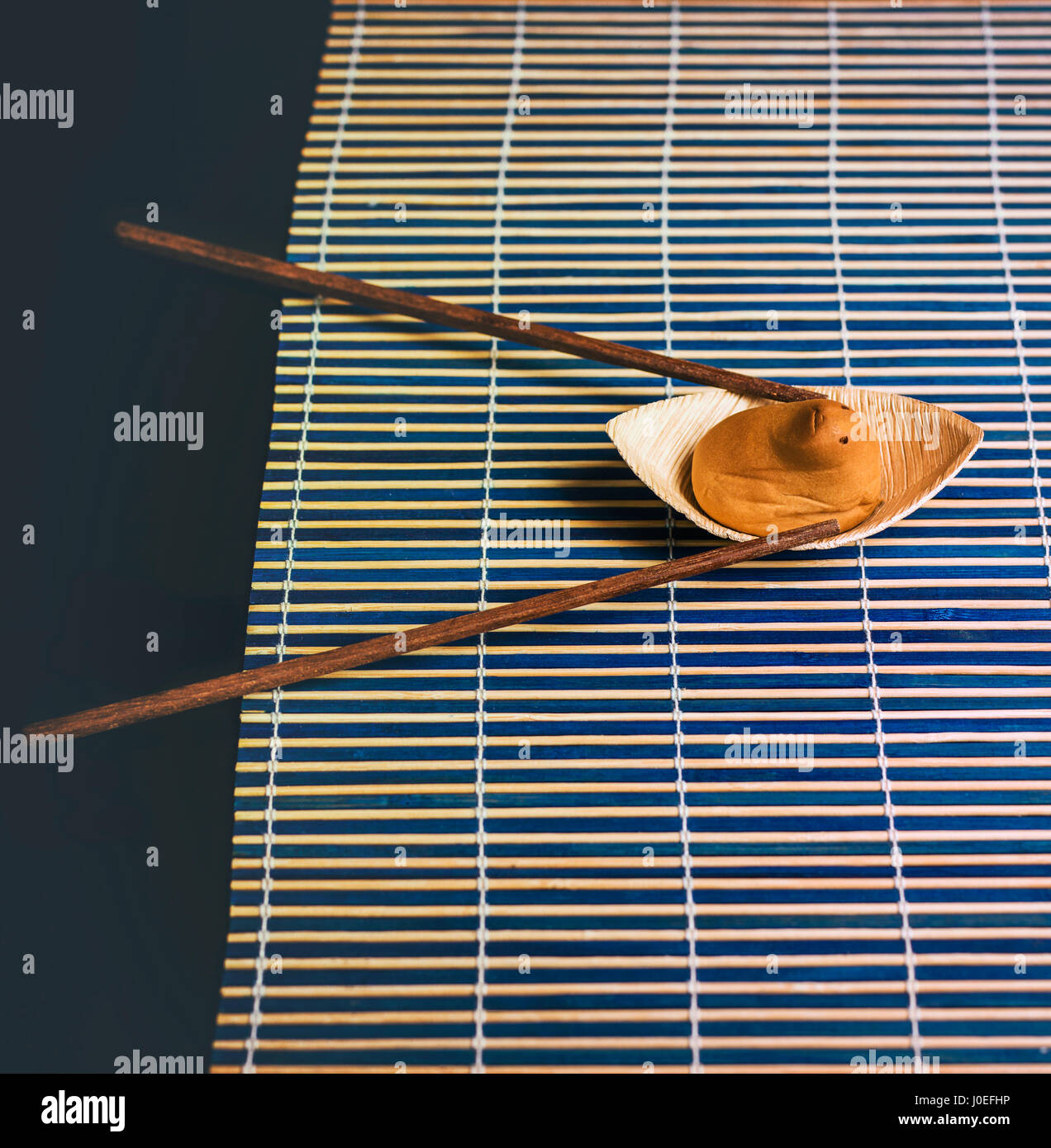Japanese sweet shaped and an funny sweet animal rowing in a bamboo river Stock Photo