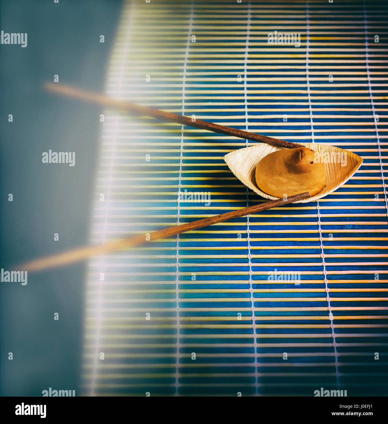 Japanese sweet shaped and an funny sweet animal rowing in a bamboo river Stock Photo