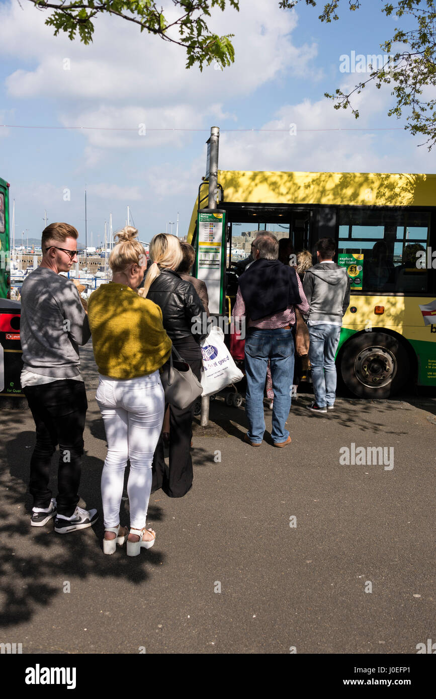 A bus queue at the main bus terminus in St. Peter Port, the Channel Islands, Britain.   The bus service is  part of the of buses.gg, fleet  of Guernse Stock Photo
