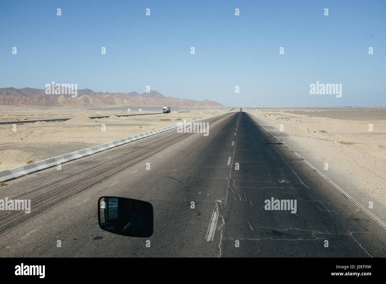 Road with a mirror between Hurghada and Cairo, Egypt. Stock Photo