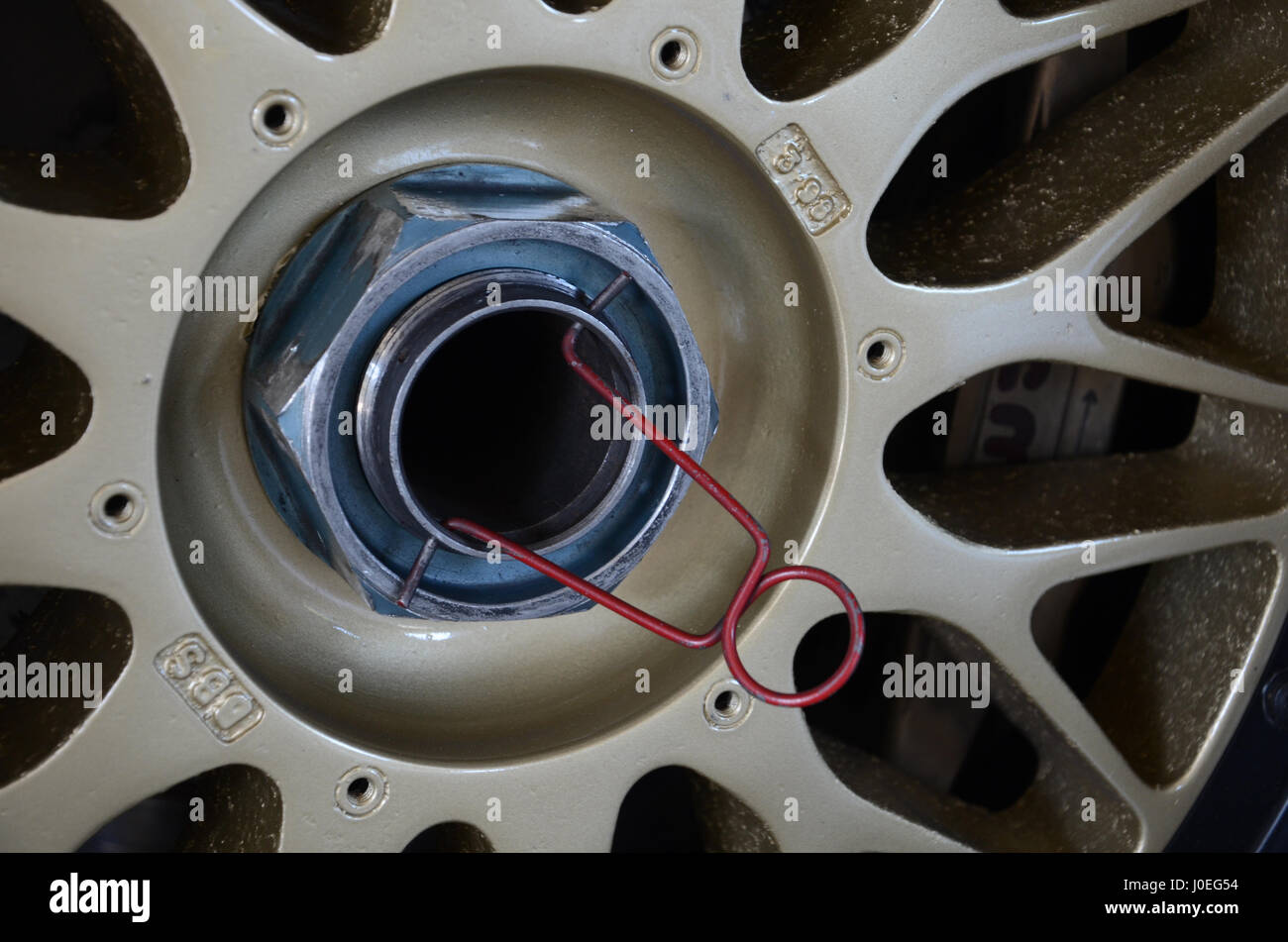 wheel nut with safety wire on racing car Stock Photo Alamy